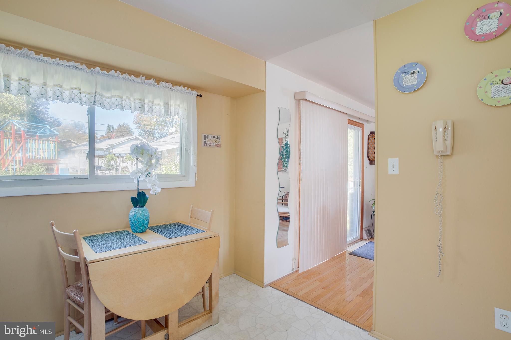 256 Candytuft Road Reisterstown, MD 21136 - Photo 19 of 37 a living room with a table and a window