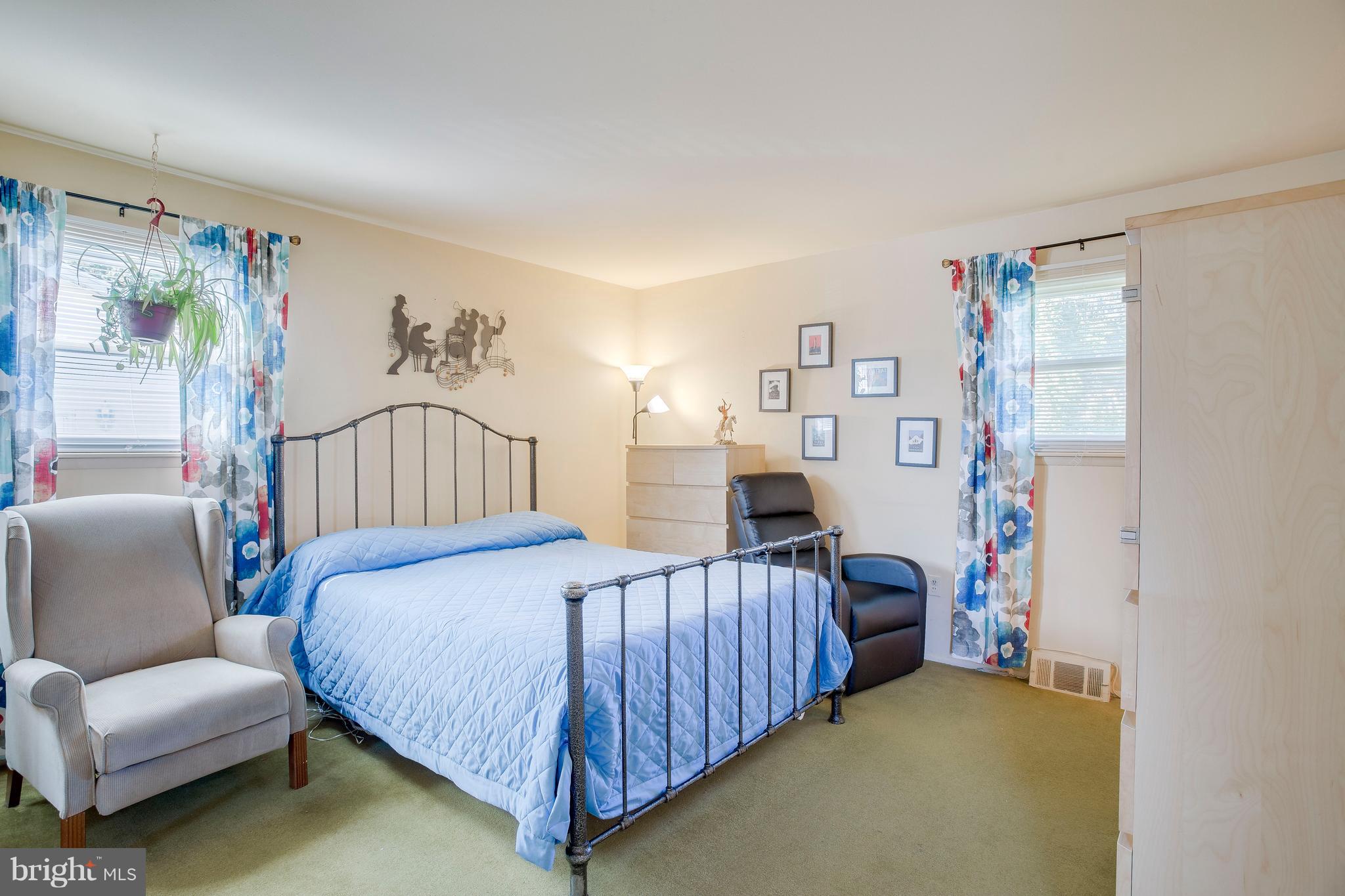 256 Candytuft Road Reisterstown, MD 21136 - Photo 20 of 37 a bedroom with a bed couch and a window