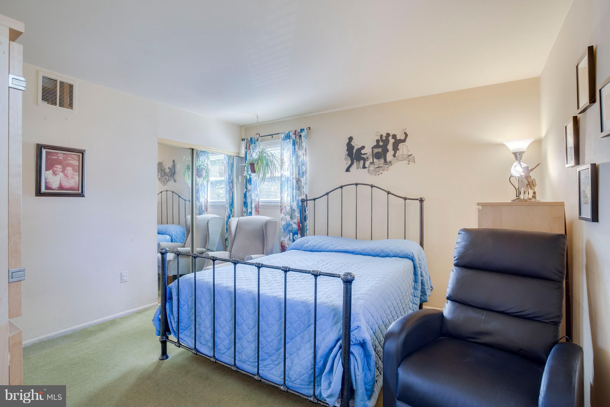 256 Candytuft Road Reisterstown, MD 21136 - Photo 21 of 37 a bedroom with a bed window and a night stand