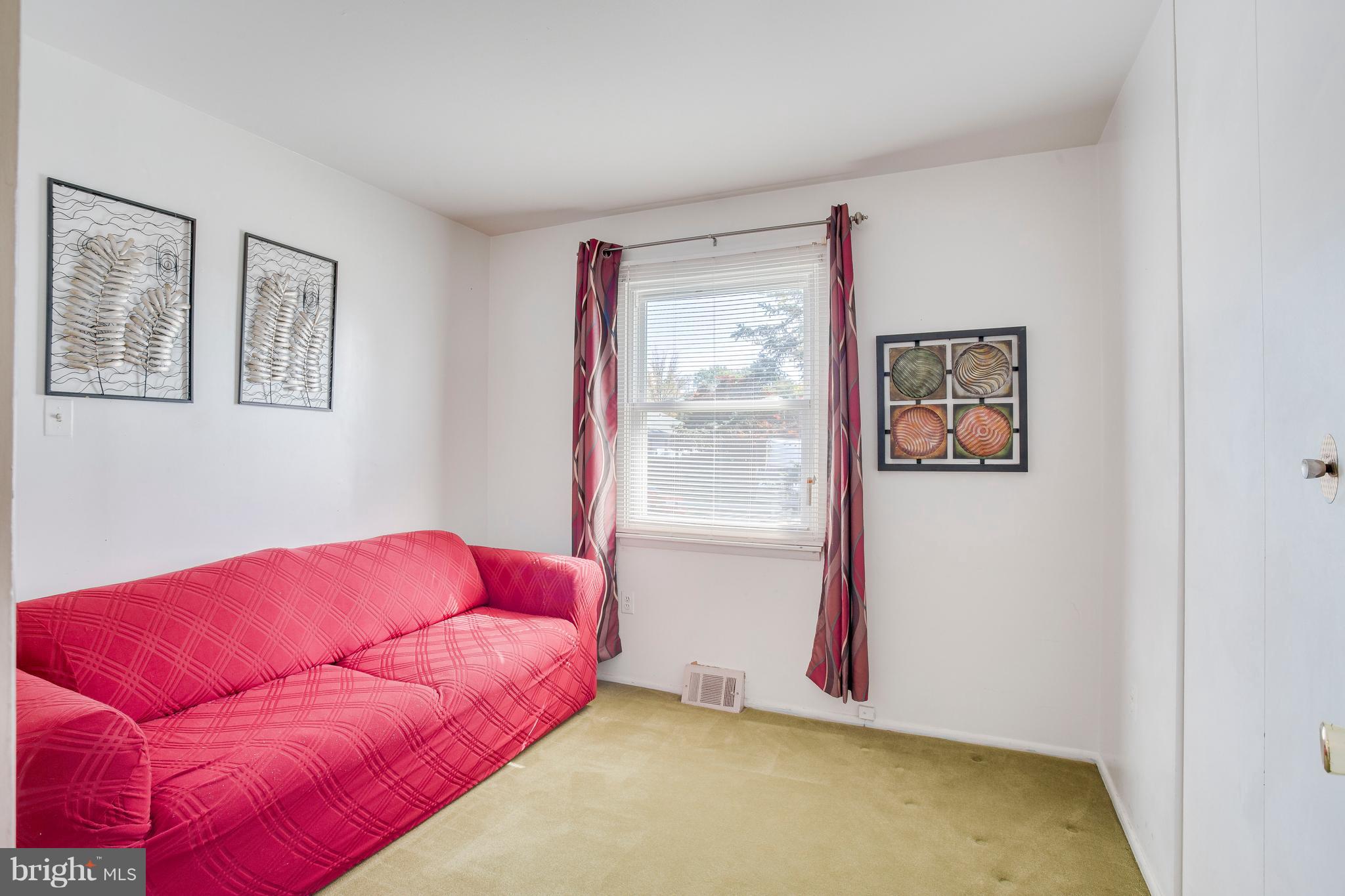 256 Candytuft Road Reisterstown, MD 21136 - Photo 23 of 37 a blue bed sitting in a bedroom next to a window