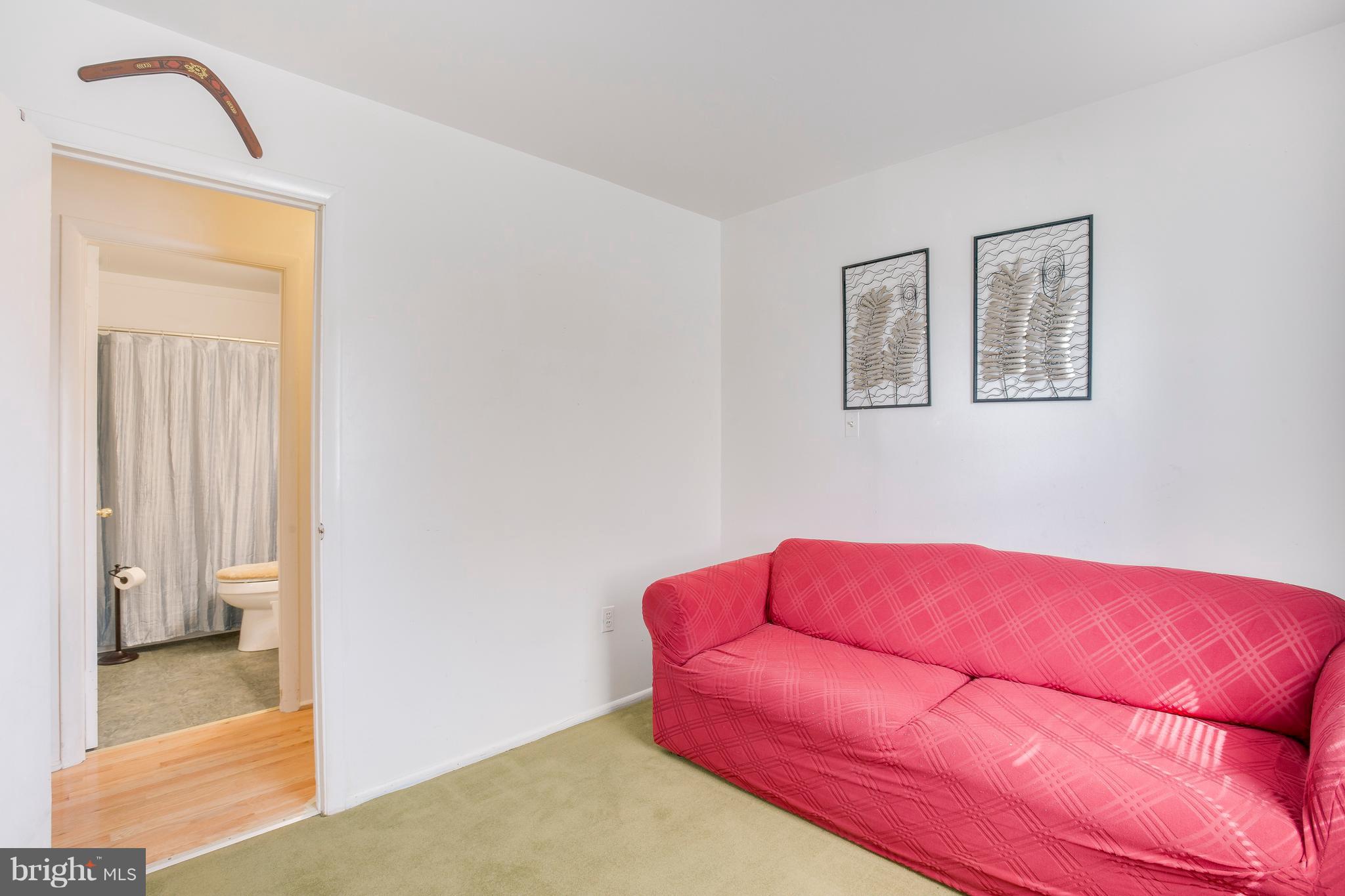 256 Candytuft Road Reisterstown, MD 21136 - Photo 24 of 37 a blue bed sitting in a bedroom next to a window