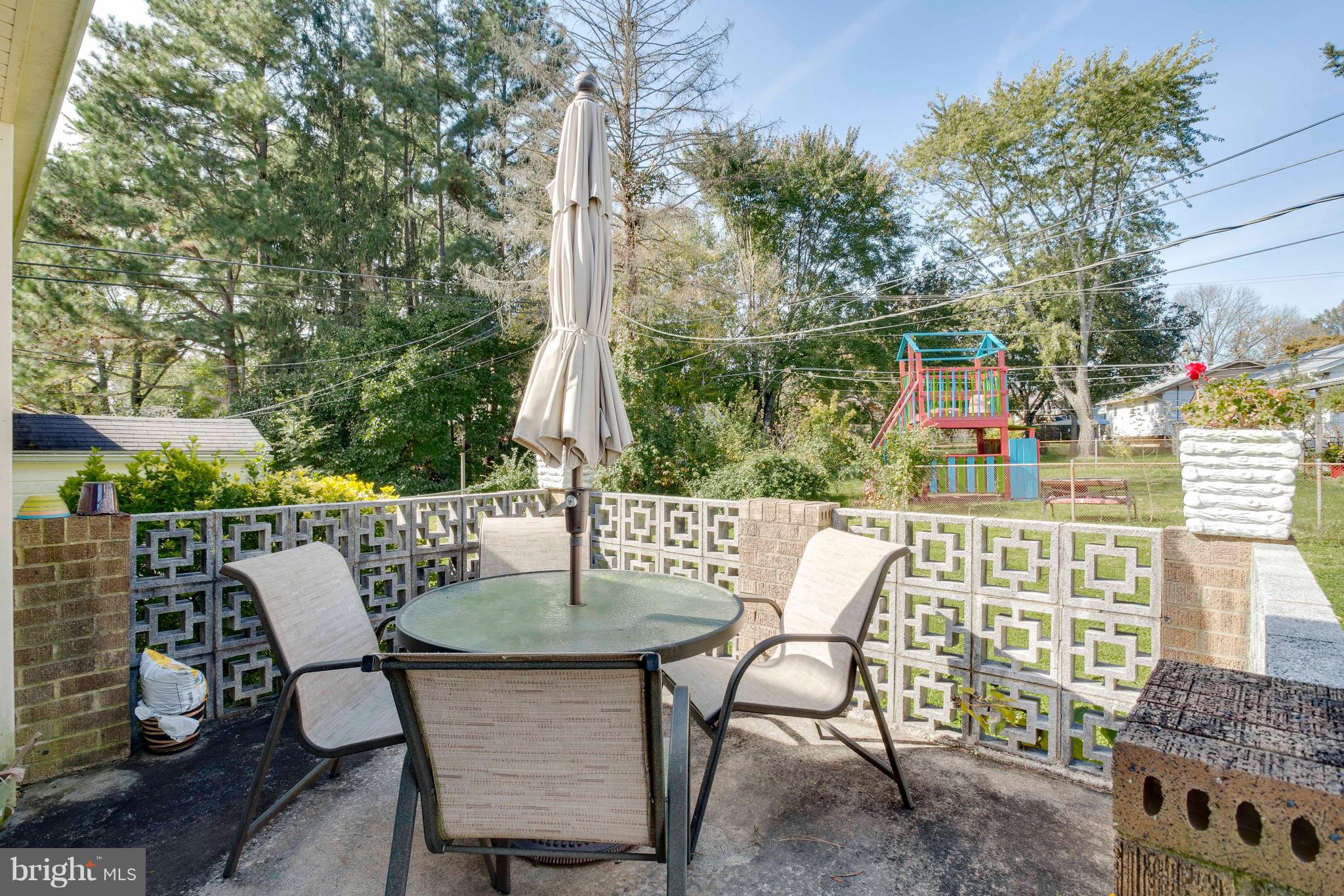 256 Candytuft Road Reisterstown, MD 21136 - Photo 35 of 37 a view of a patio with table and chairs and potted plants
