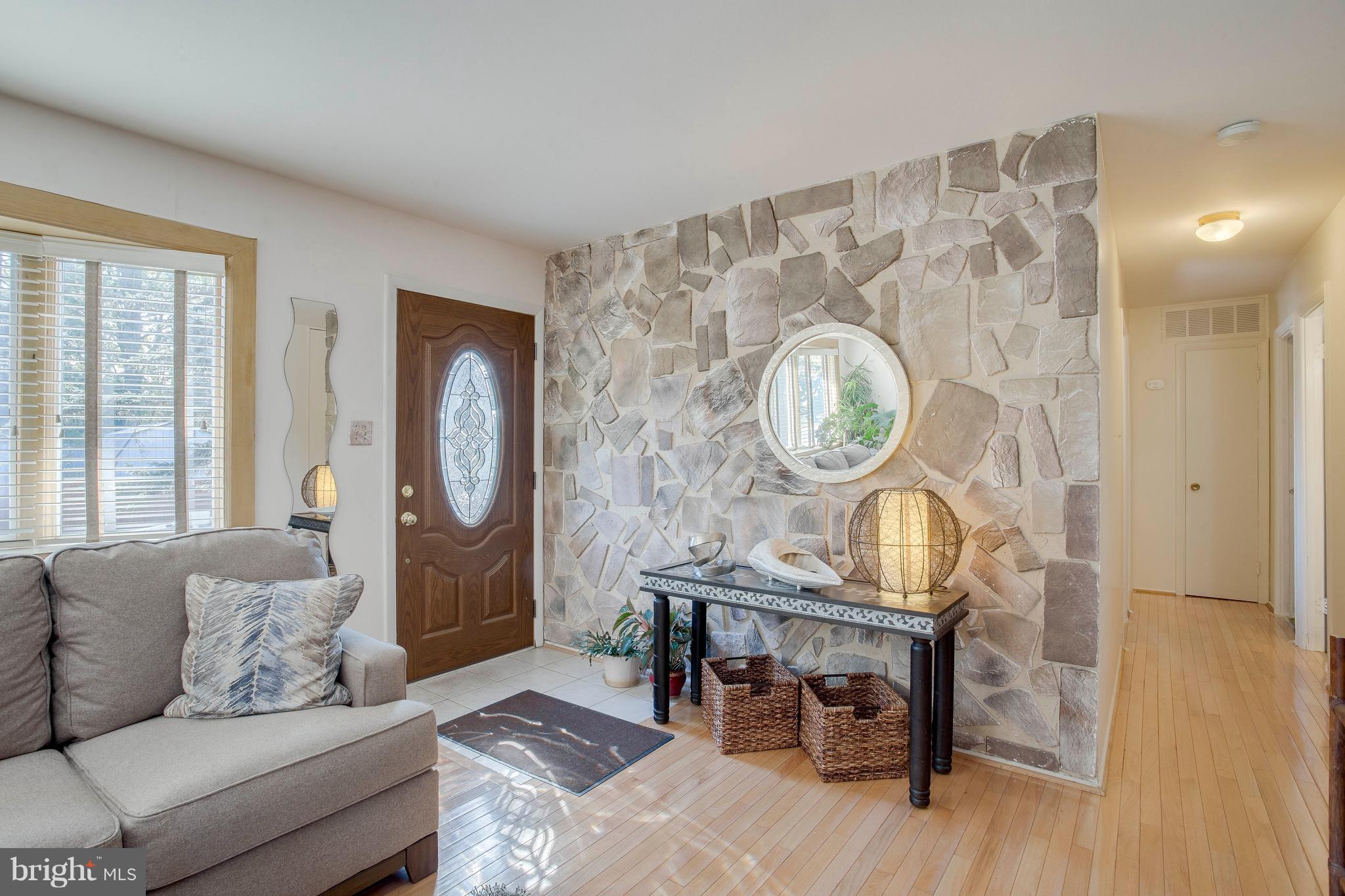 256 Candytuft Road Reisterstown, MD 21136 - Photo 6 of 37 a living room with furniture a window and a clock