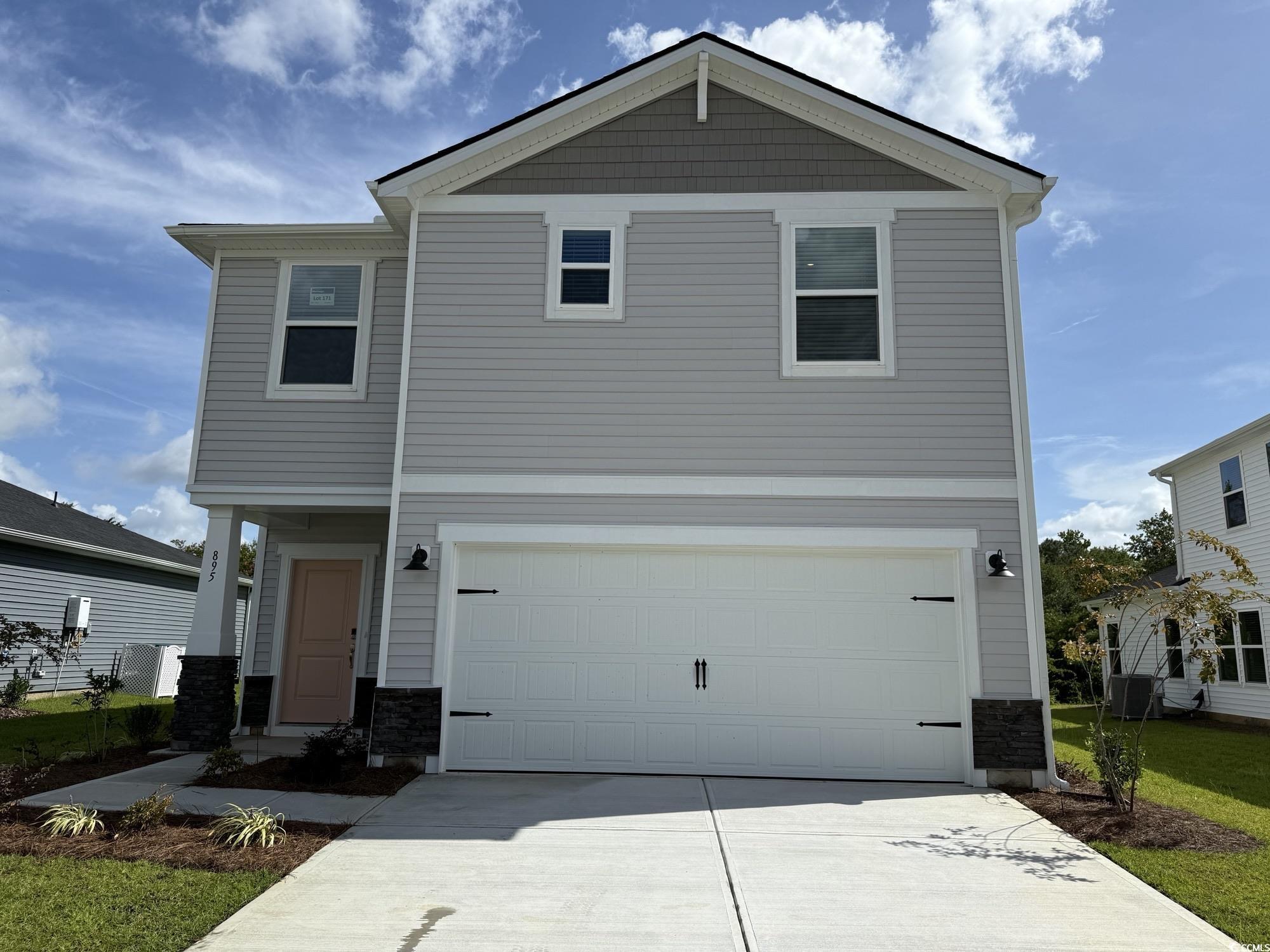 895 Cypress Preserve Circle Longs, SC 29568 - Photo 1 of 4 View of front facade with a garage, driveway, and stone siding