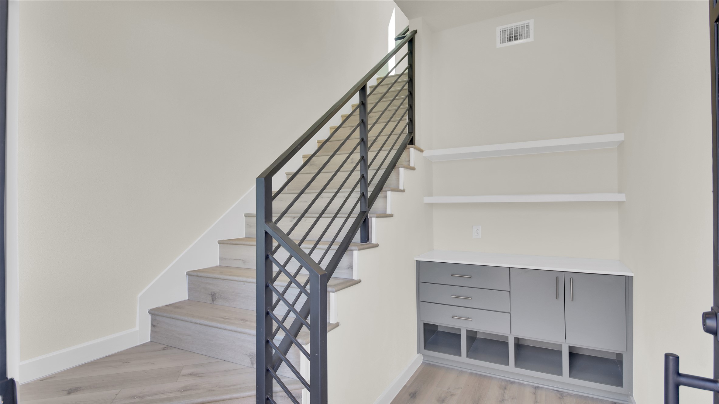 6802 Montana Street, Unit 2 Austin, TX 78741 - Photo 3 of 11 Staircase with wood finished floors and baseboards