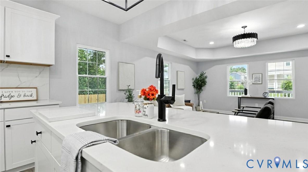 409 Mistletoe Street Petersburg, VA 23803 - Photo 13 of 40 a kitchen with a sink and a large window