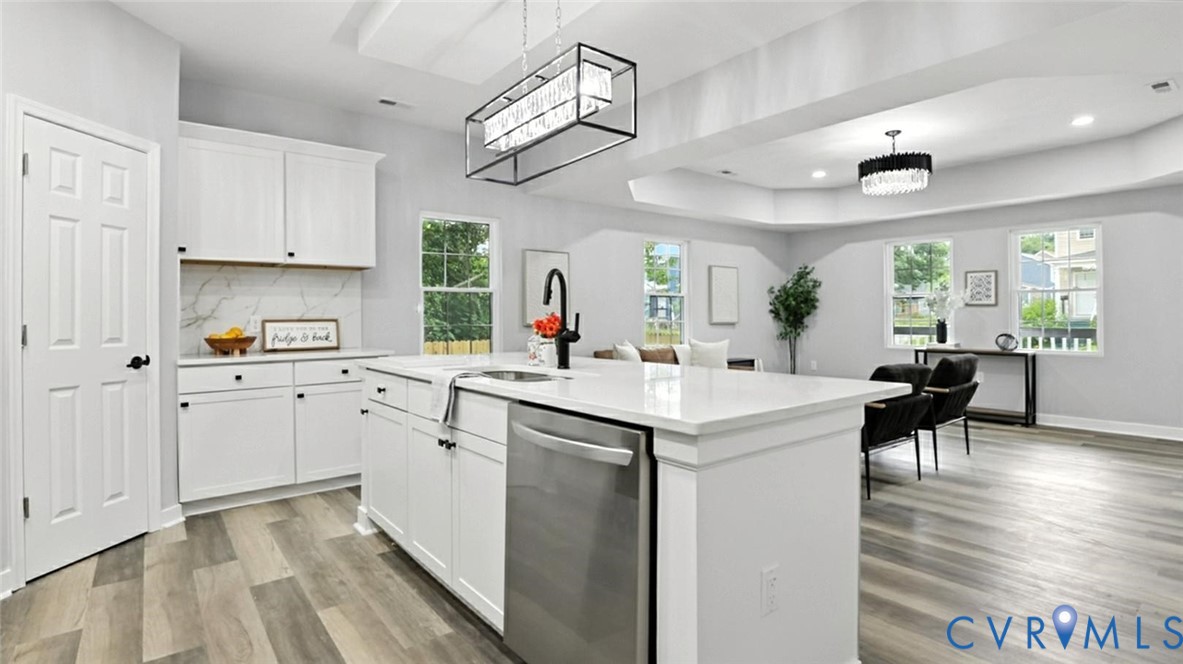409 Mistletoe Street Petersburg, VA 23803 - Photo 15 of 40 a kitchen with cabinets a sink and appliances