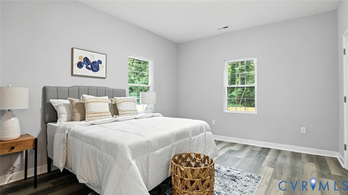 409 Mistletoe Street Petersburg, VA 23803 - Photo 18 of 40 a bedroom with a bed and a window