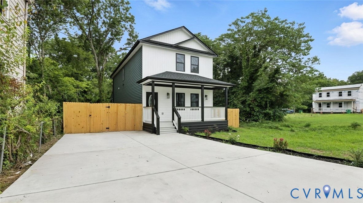 409 Mistletoe Street Petersburg, VA 23803 - Photo 2 of 40 a front view of a house with yard and green space