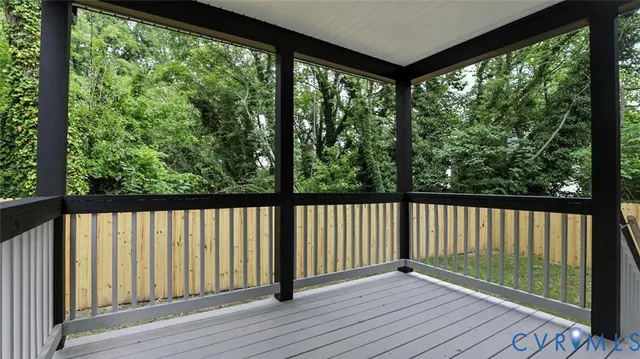 a view of balcony with wooden floor