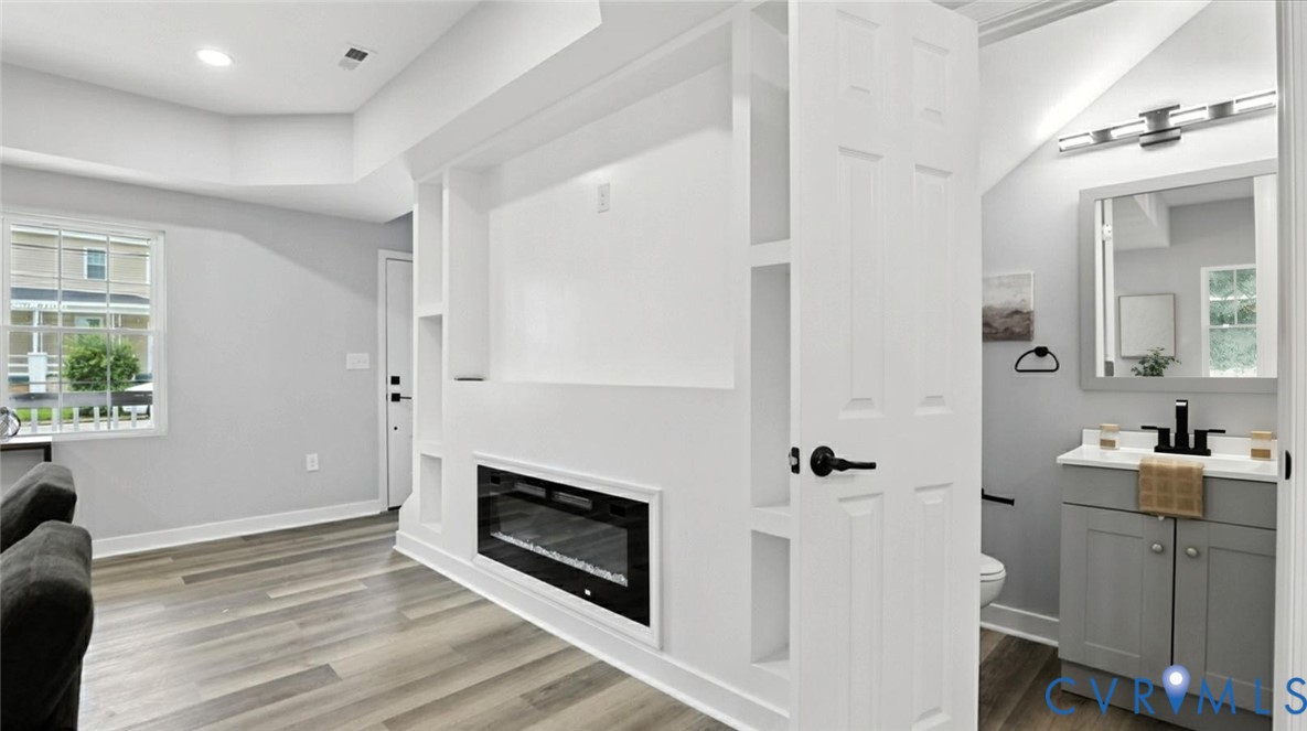 409 Mistletoe Street Petersburg, VA 23803 - Photo 26 of 40 a bathroom with a sink and a mirror