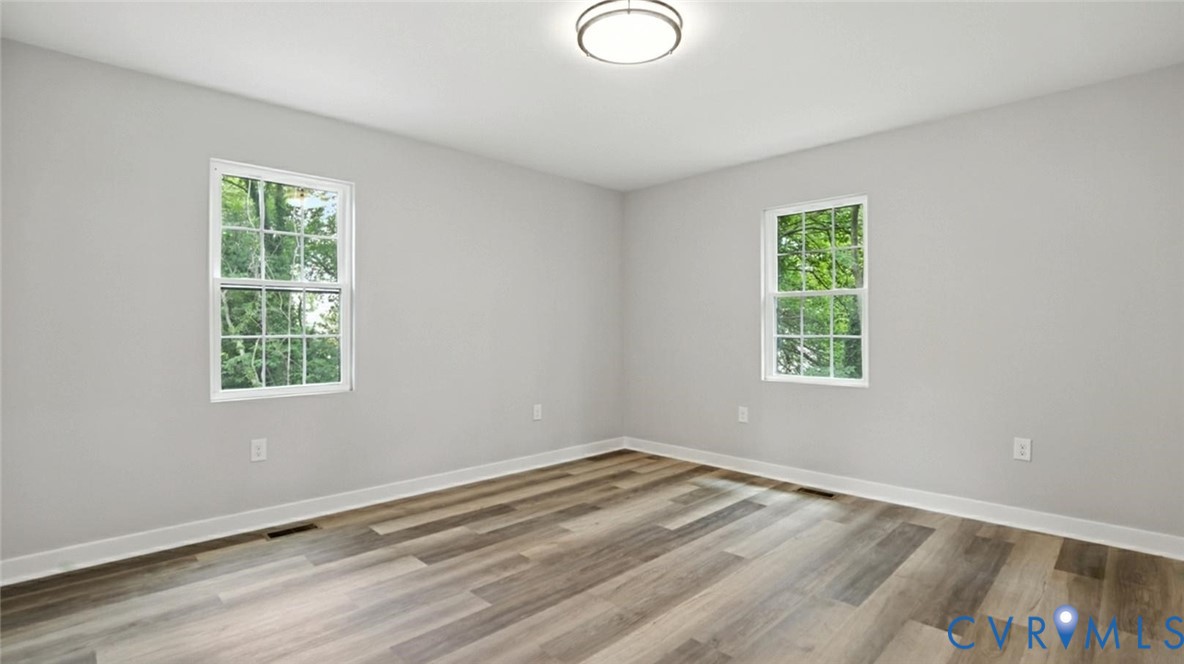 409 Mistletoe Street Petersburg, VA 23803 - Photo 32 of 40 wooden floor in an empty room with a window