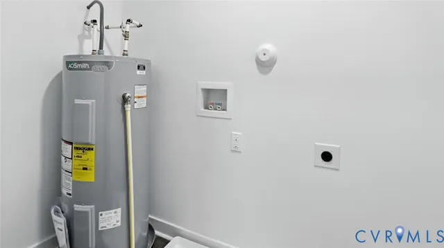 a bathroom with a toilet a sink and shower