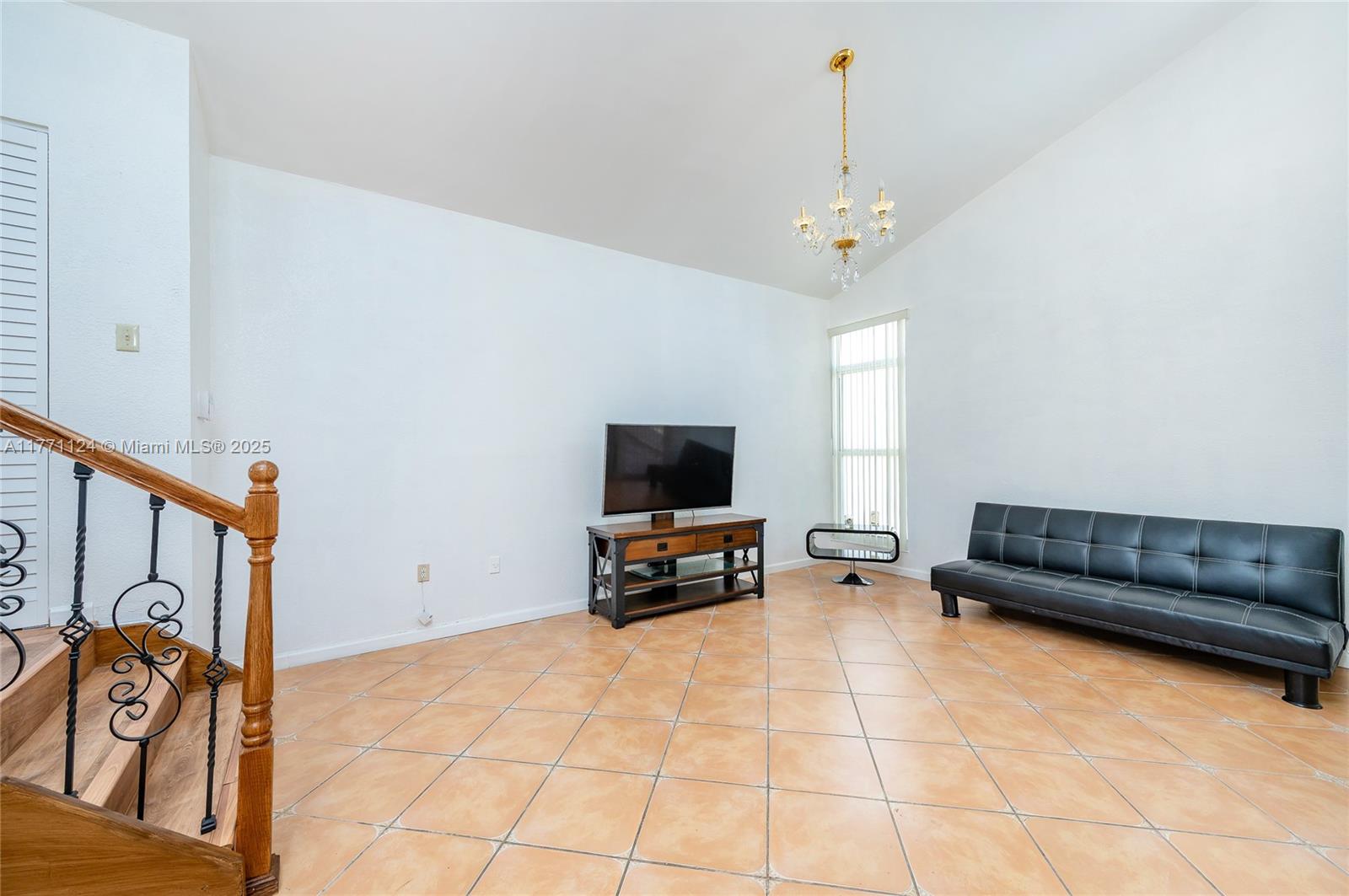 1007 Northwest 106th Ave Circle Miami, FL 33172 - Photo 15 of 41 a living room with furniture and a flat screen tv