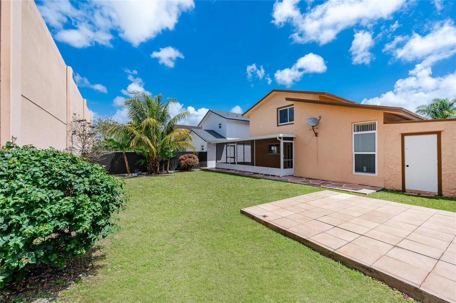 1007 Northwest 106th Ave Circle Miami, FL 33172 - Photo 16 of 41 a front view of a house with a garden