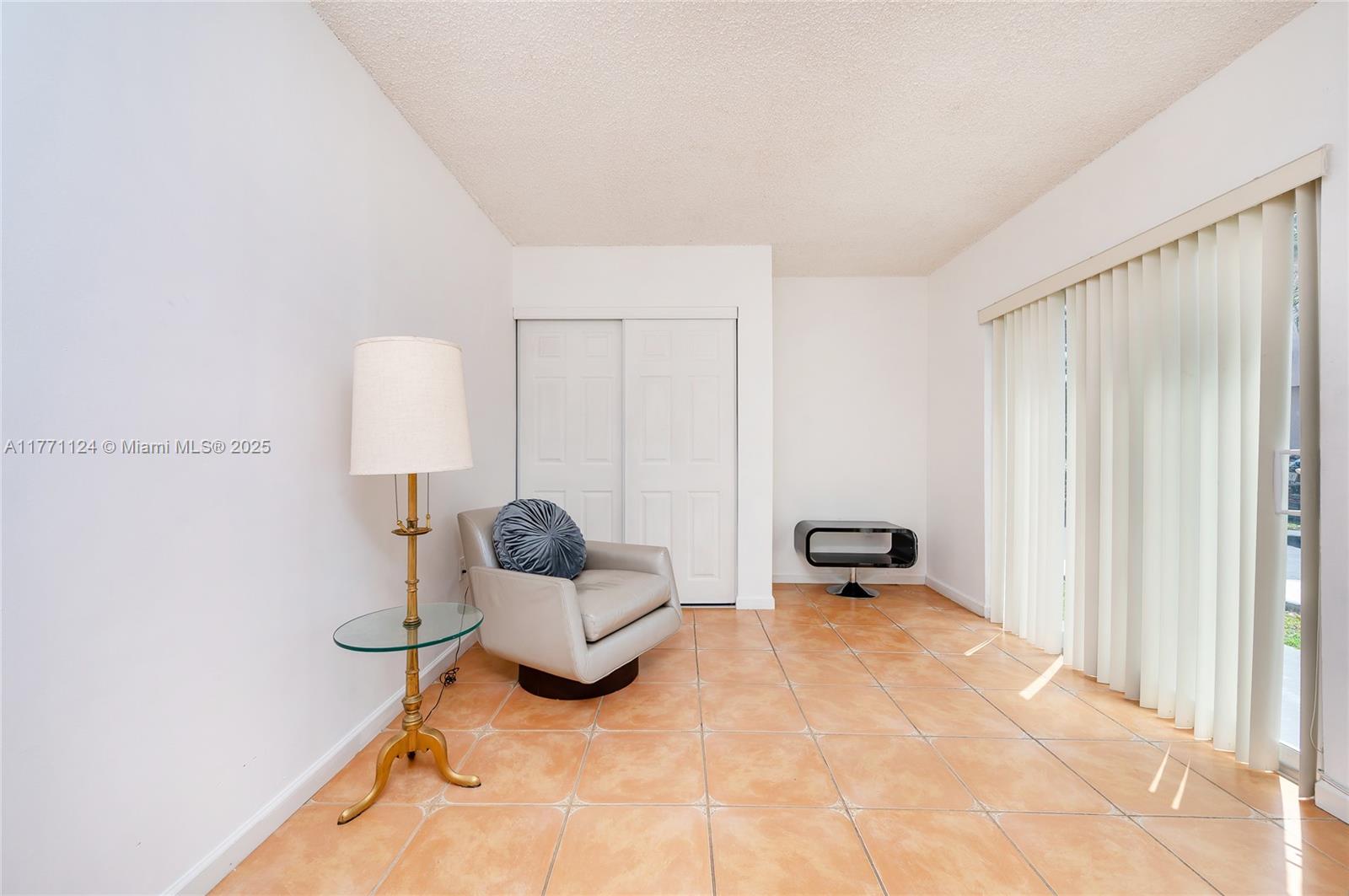 1007 Northwest 106th Ave Circle Miami, FL 33172 - Photo 18 of 41 a room with furniture and a window