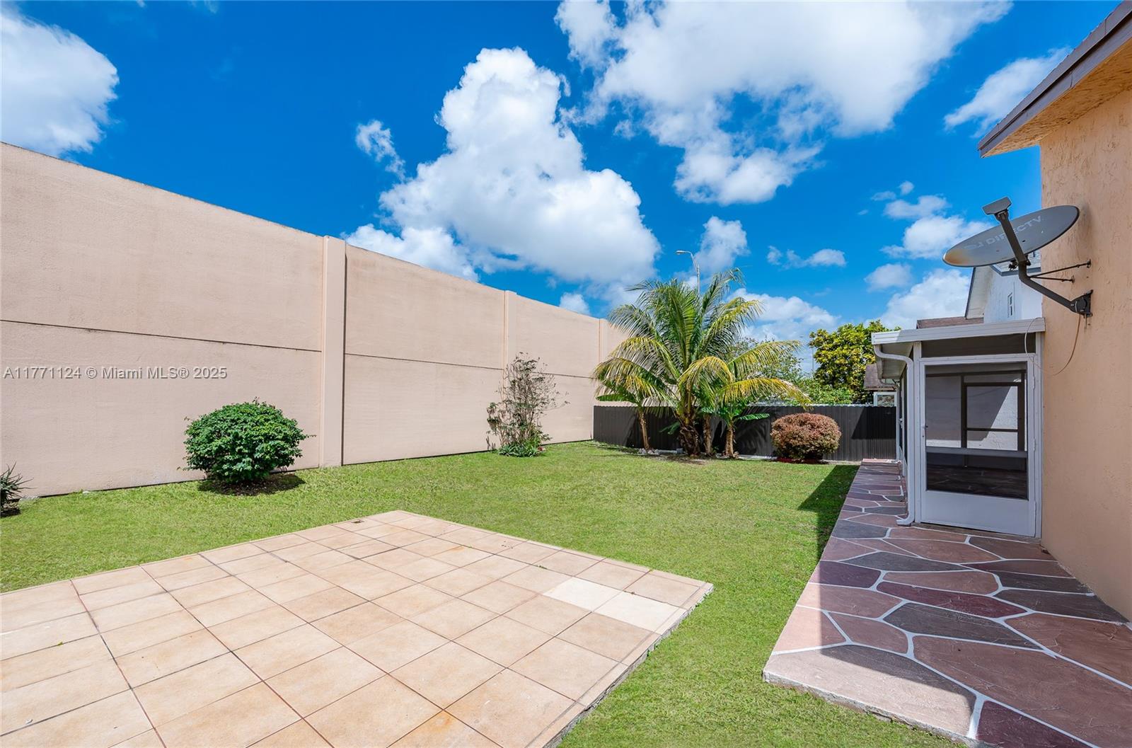 1007 Northwest 106th Ave Circle Miami, FL 33172 - Photo 19 of 41 a view of a backyard with potted plants
