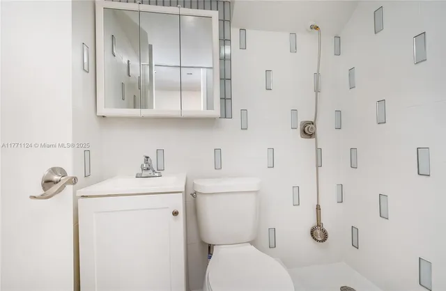 a view of an empty room with a yard and a floor to ceiling window