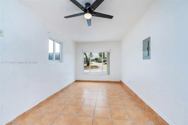 a bedroom with a bed and a tv