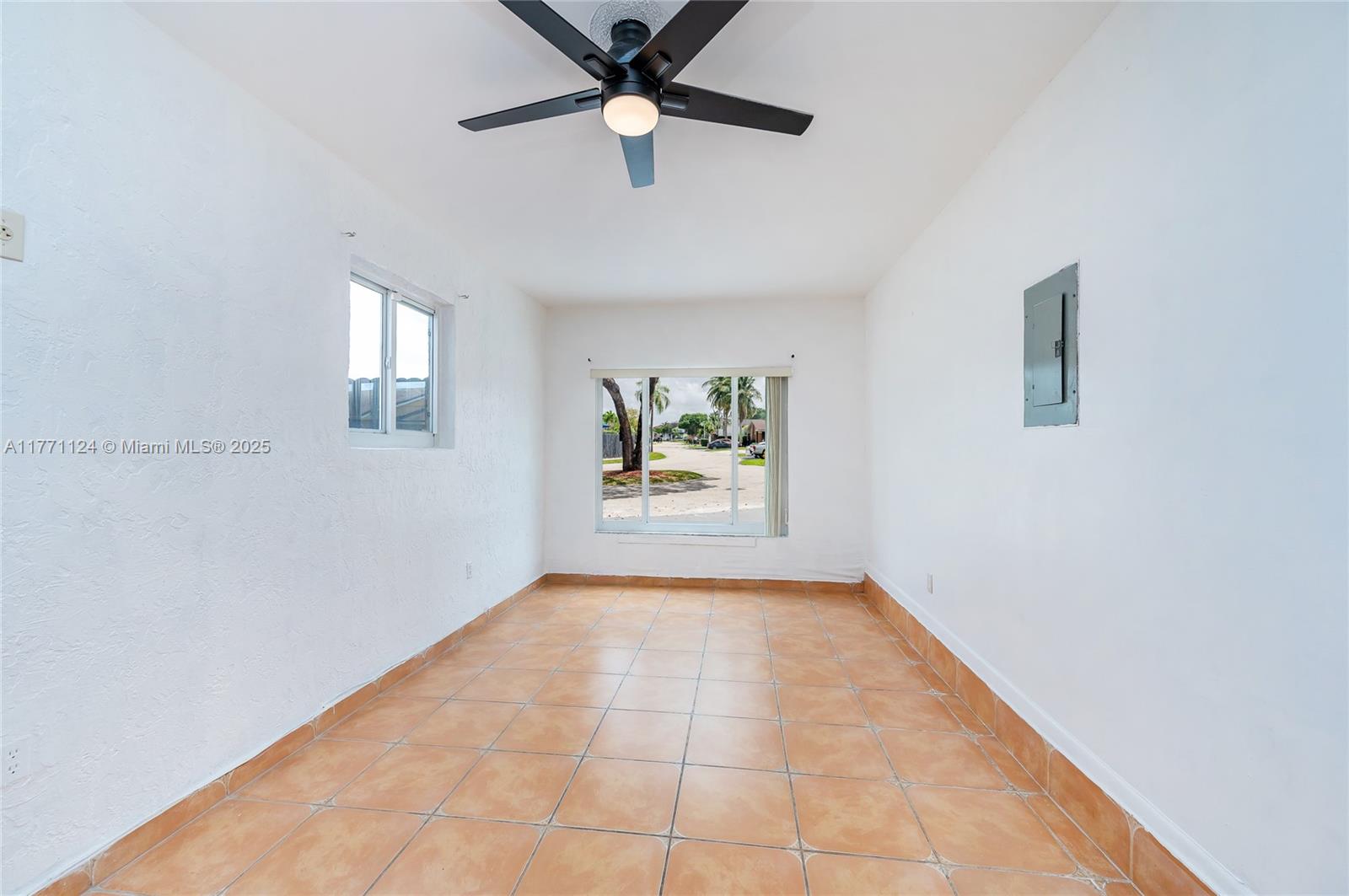 1007 Northwest 106th Ave Circle Miami, FL 33172 - Photo 24 of 41 an empty room with windows and fan