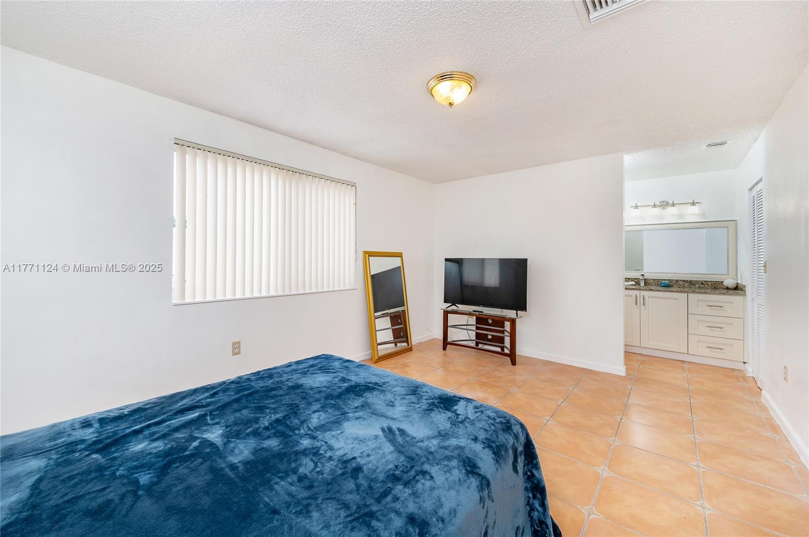 1007 Northwest 106th Ave Circle Miami, FL 33172 - Photo 28 of 41 a view of a livingroom with furniture and a flat screen tv