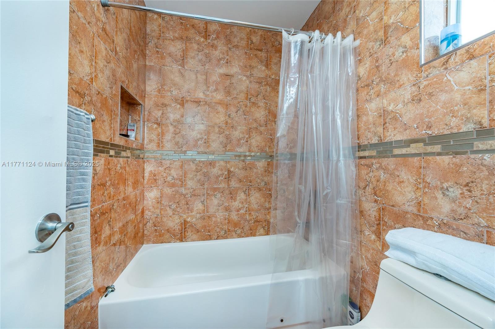 1007 Northwest 106th Ave Circle Miami, FL 33172 - Photo 30 of 41 a bathroom with a bathtub and shower