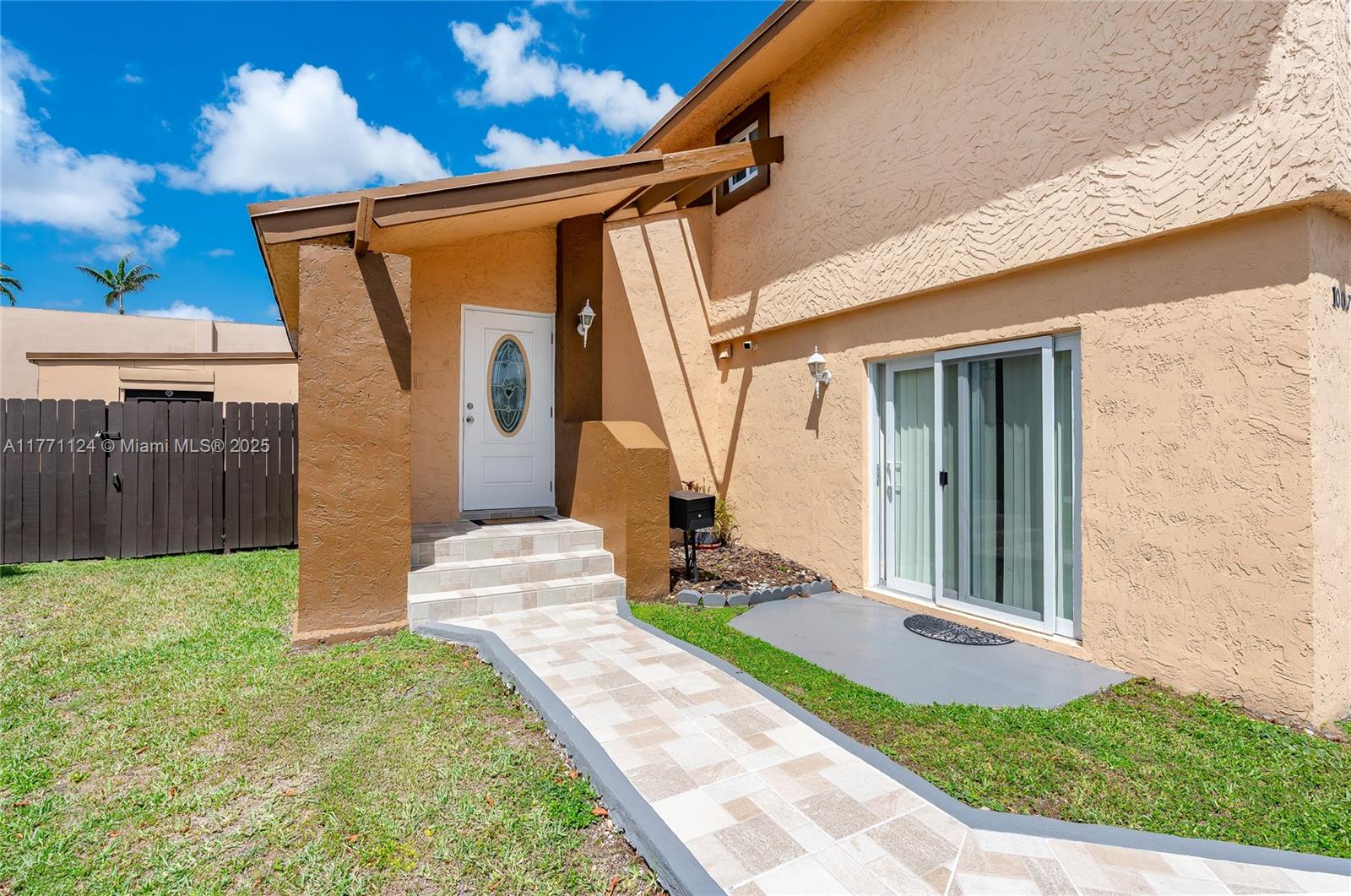 1007 Northwest 106th Ave Circle Miami, FL 33172 - Photo 5 of 41 a front view of a house with garden