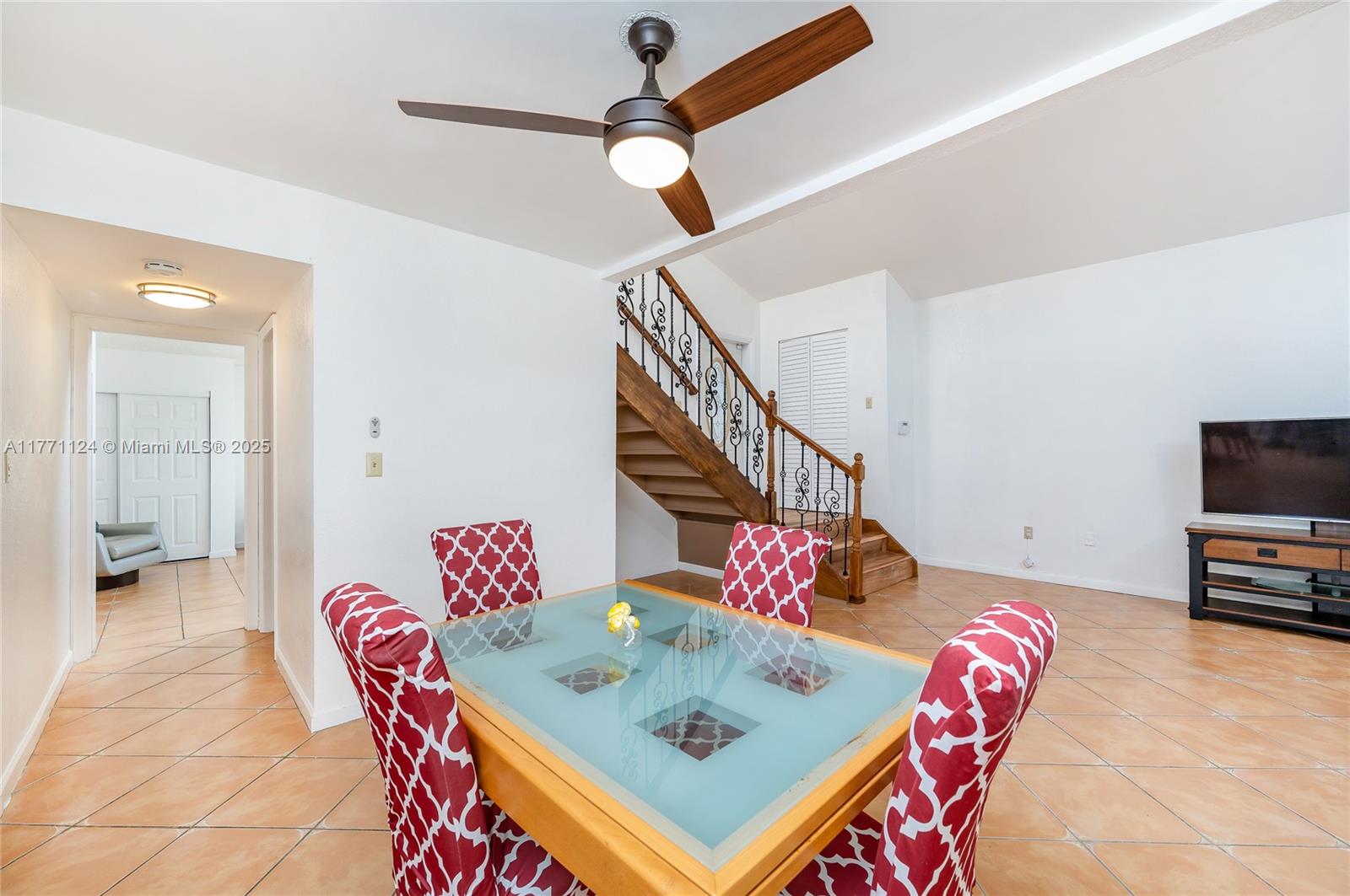 1007 Northwest 106th Ave Circle Miami, FL 33172 - Photo 6 of 41 a living room with furniture and a flat screen tv