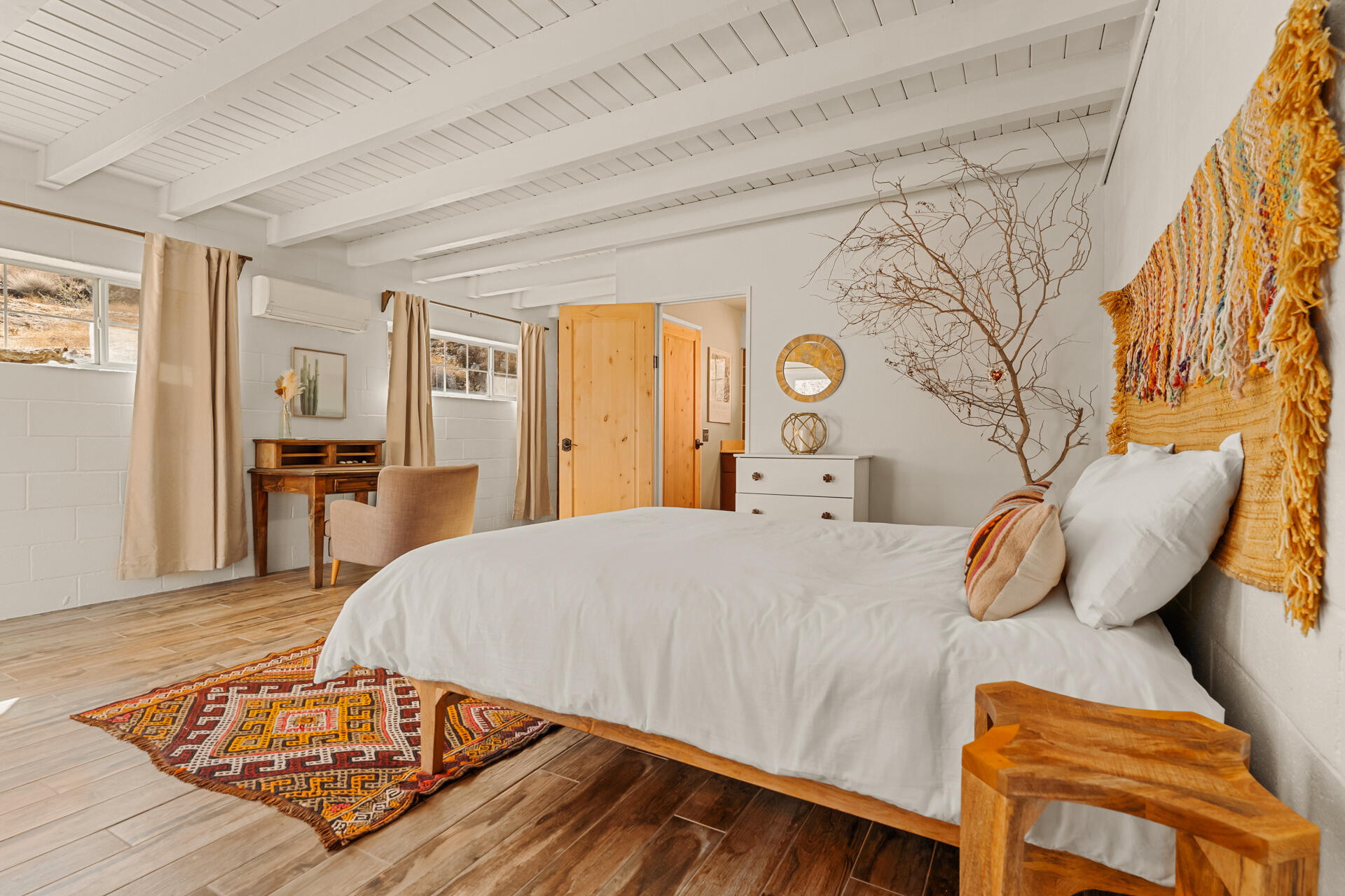 53019 Apache Trail Morongo Valley, CA 92256 - Photo 12 of 37 a bedroom with a bed and wooden floor