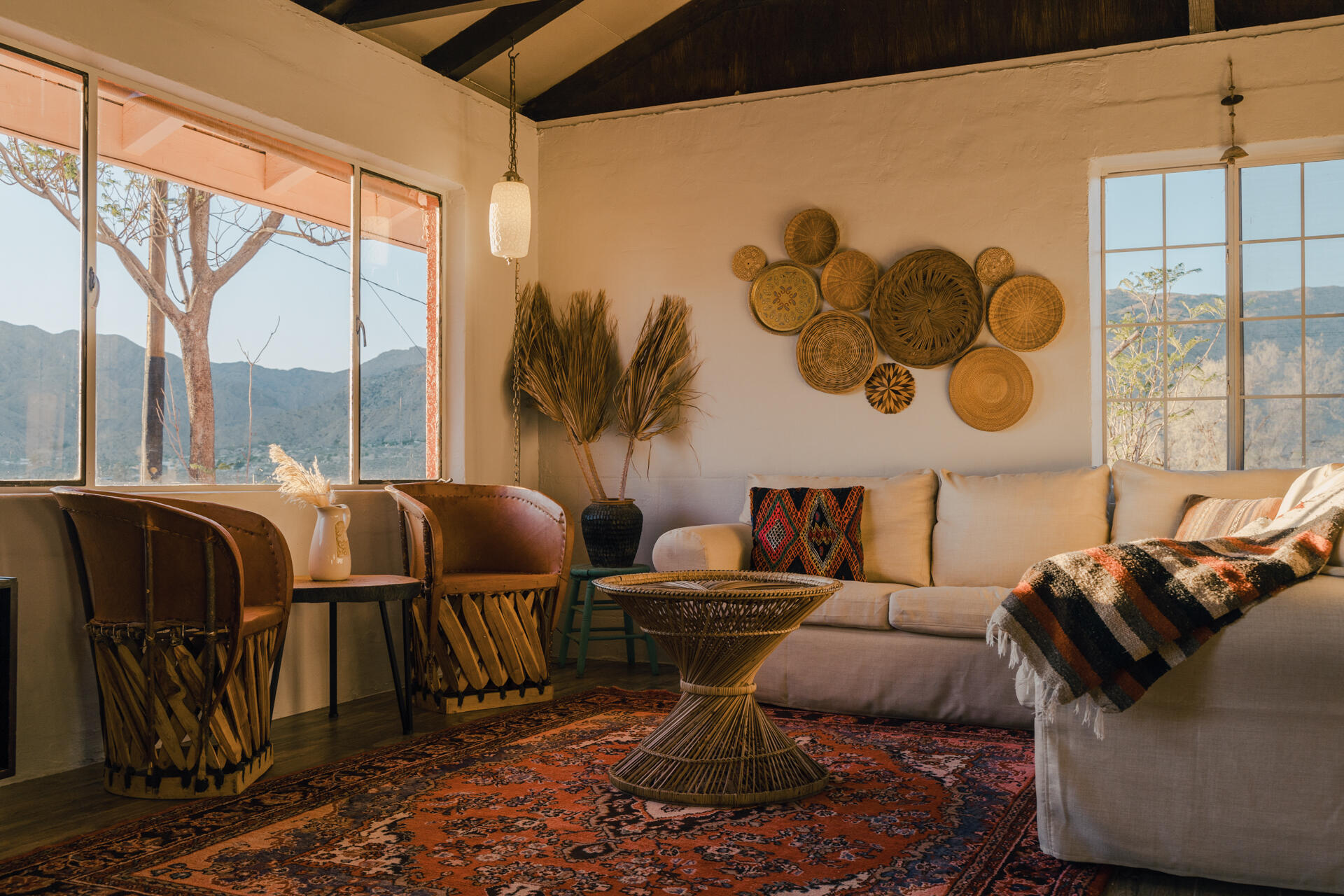 53019 Apache Trail Morongo Valley, CA 92256 - Photo 37 of 37 a living room with couches painting on the wall and a large window