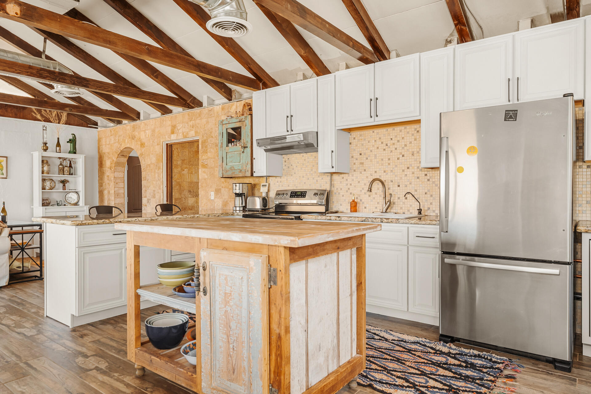 53019 Apache Trail Morongo Valley, CA 92256 - Photo 6 of 37 a kitchen with a refrigerator a stove and a sink