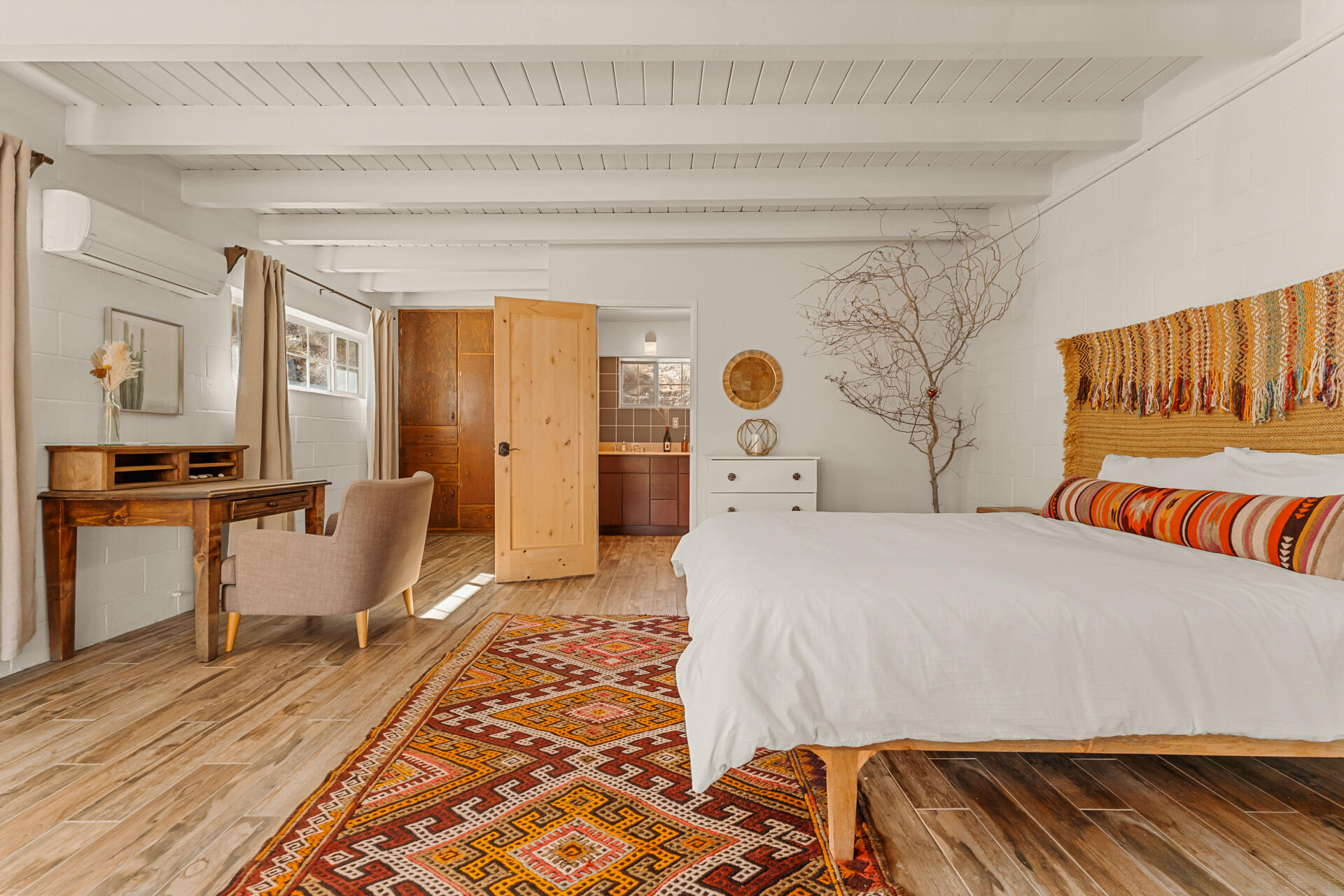 53019 Apache Trail Morongo Valley, CA 92256 - Photo 10 of 37 a bedroom with a bed and wooden floor