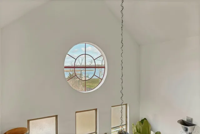 with a bathroom with a vanity a mirror and a glass door