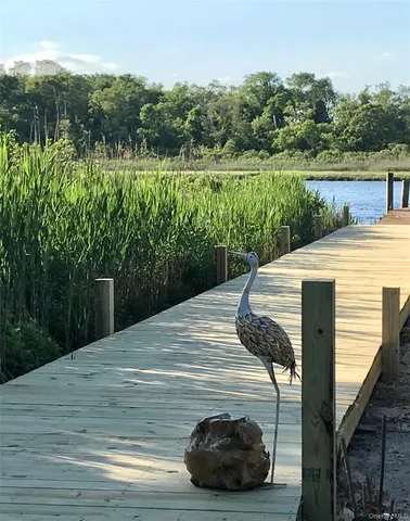 a view of a wooden deck and a lake view