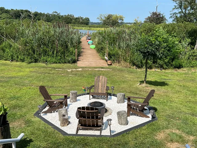 a view of a lake with a garden and plants