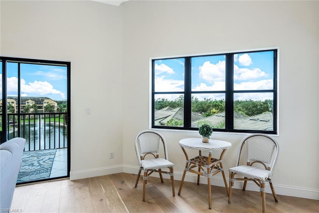 195 Vintage Circle, Unit E403 Naples, FL 34119 - Photo 12 of 39 a view of a dining room with furniture window and outside view