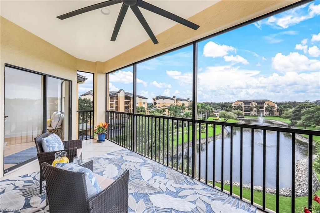 195 Vintage Circle, Unit E403 Naples, FL 34119 - Photo 13 of 39 a balcony with furniture and city view