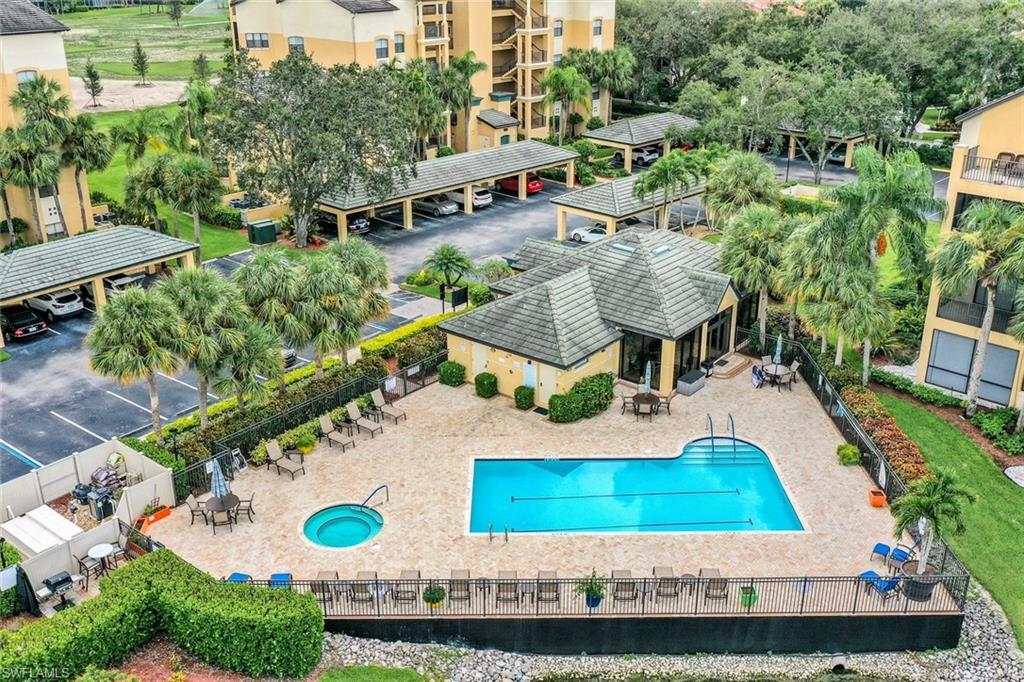 195 Vintage Circle, Unit E403 Naples, FL 34119 - Photo 30 of 39 an aerial view of a house having yard