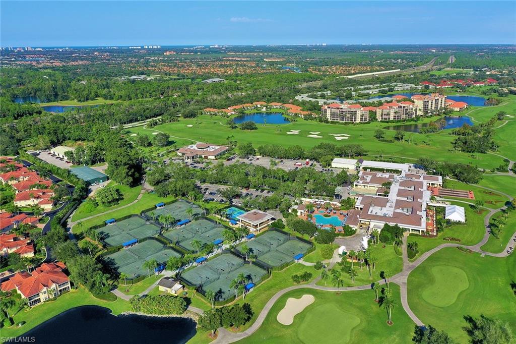 195 Vintage Circle, Unit E403 Naples, FL 34119 - Photo 36 of 39 a view of city with lush green forest