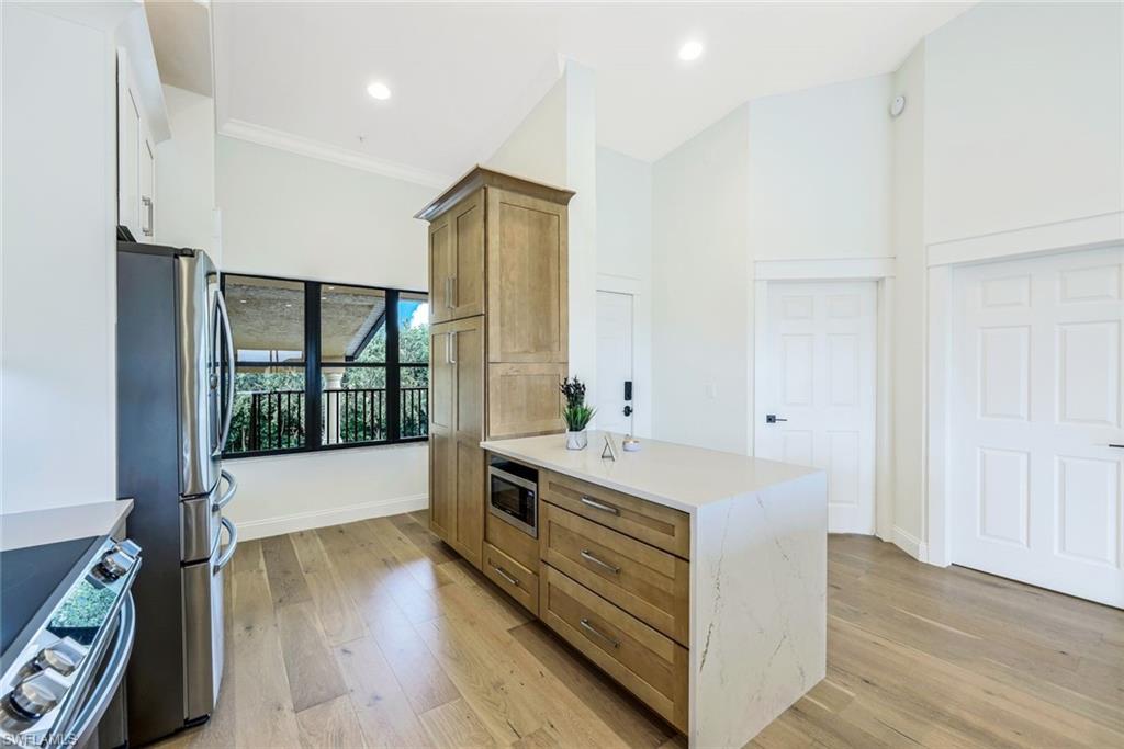 195 Vintage Circle, Unit E403 Naples, FL 34119 - Photo 8 of 39 a view of bathroom with dual sinks