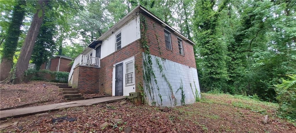 2980 Wanda Circle Southwest Atlanta, GA 30315 - Photo 2 of 11 a view of a house with a yard