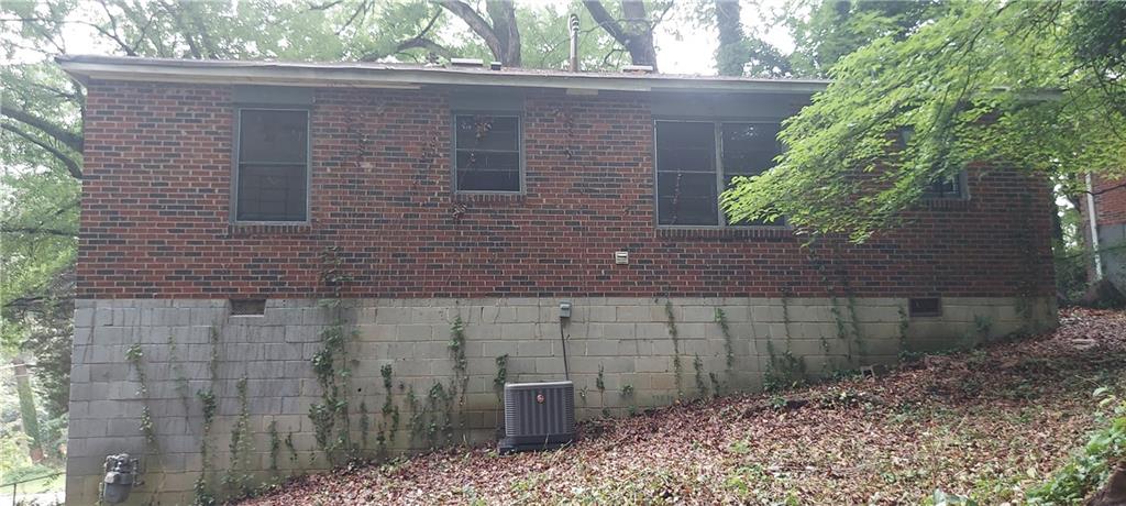 2980 Wanda Circle Southwest Atlanta, GA 30315 - Photo 3 of 11 a brick house with a large windows