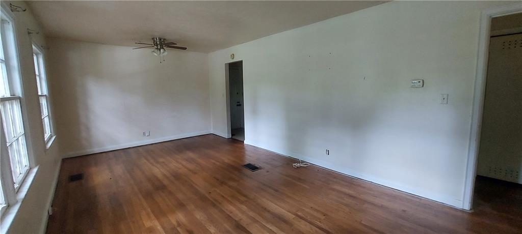 2980 Wanda Circle Southwest Atlanta, GA 30315 - Photo 5 of 11 an empty room with wooden floor