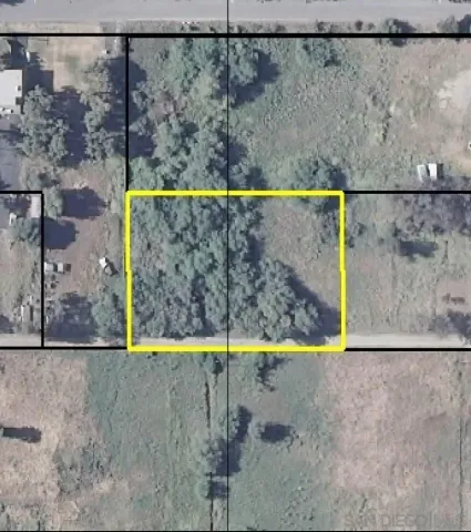 a view of road covered with trees