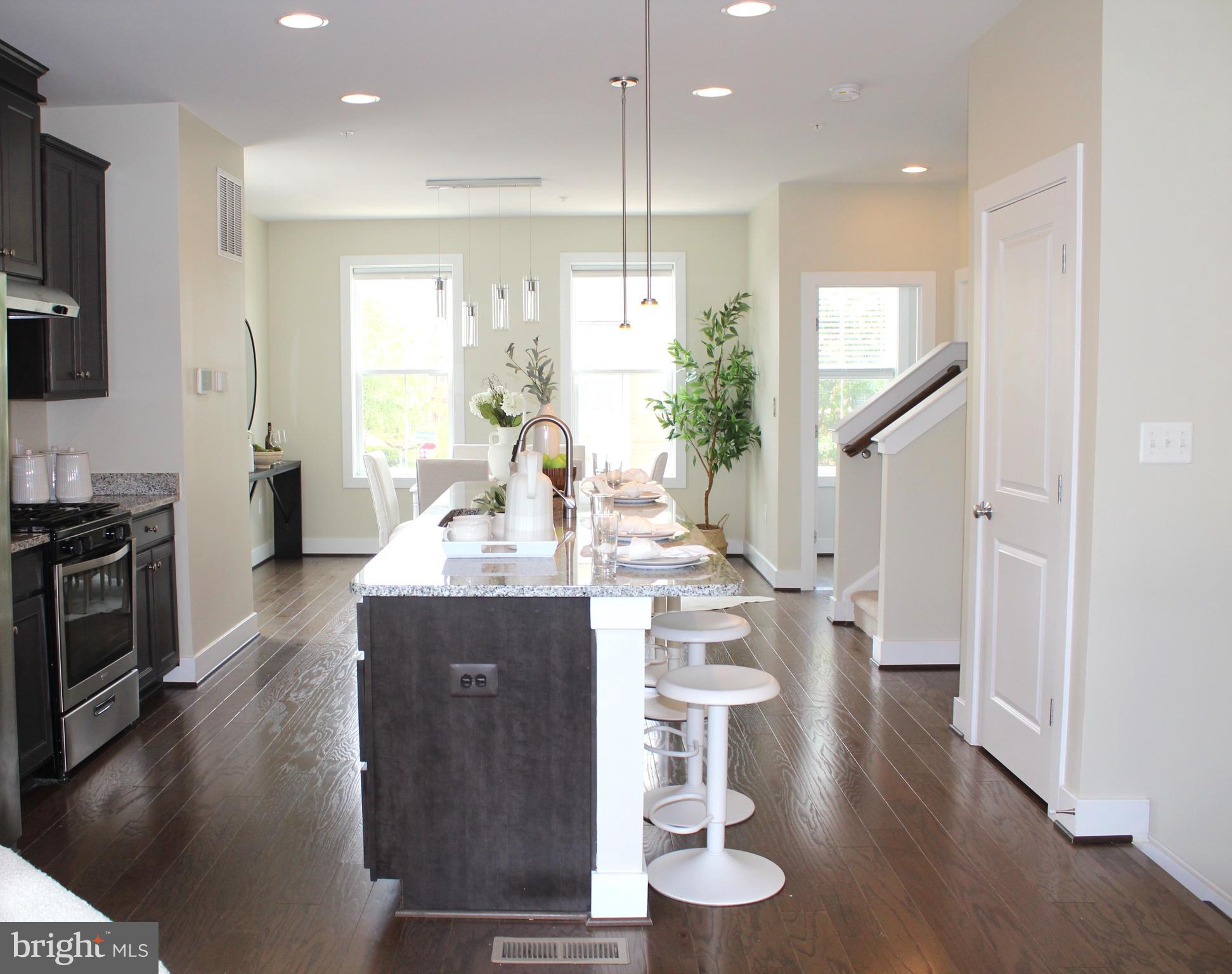 2411 Auden Drive Silver Spring, MD 20906 - Photo 15 of 45 a view of kitchen and dining room with wooden floor