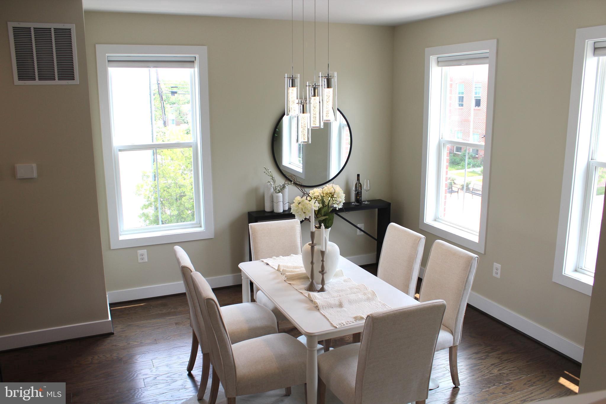 2411 Auden Drive Silver Spring, MD 20906 - Photo 17 of 45 a view of a dining room with furniture window and wooden floor