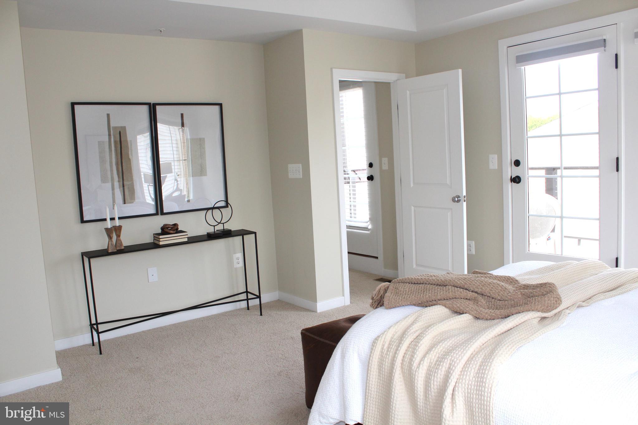 2411 Auden Drive Silver Spring, MD 20906 - Photo 22 of 45 a bedroom with a bed and a mirror