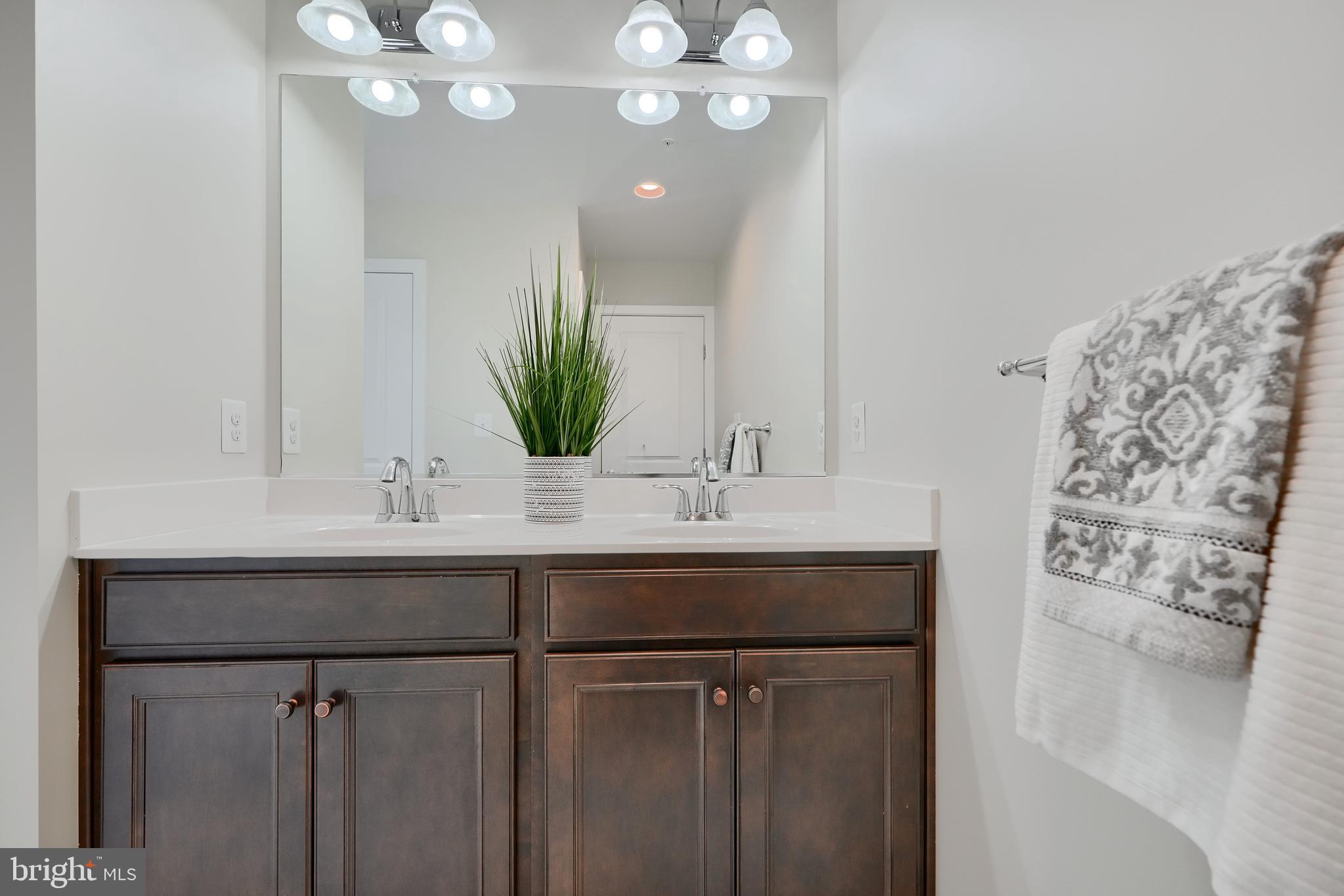 2411 Auden Drive Silver Spring, MD 20906 - Photo 32 of 45 a bathroom with a sink and a mirror