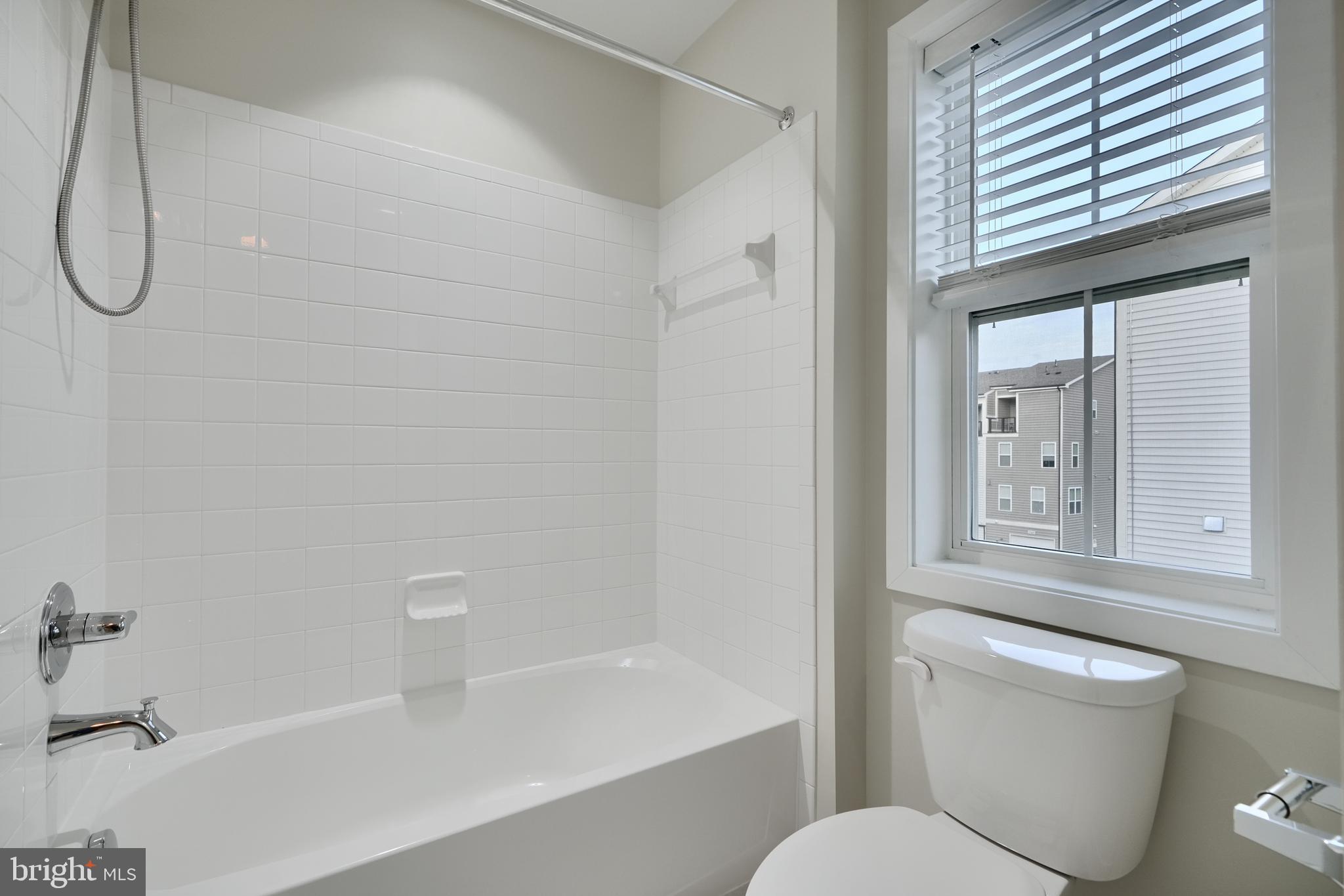 2411 Auden Drive Silver Spring, MD 20906 - Photo 34 of 45 a bathroom with a toilet and a bathtub