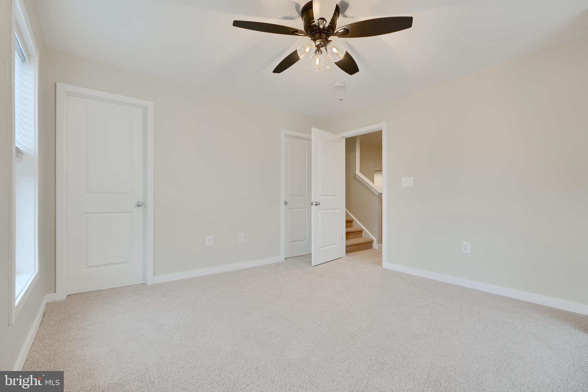 2411 Auden Drive Silver Spring, MD 20906 - Photo 36 of 45 an empty room with closet and windows